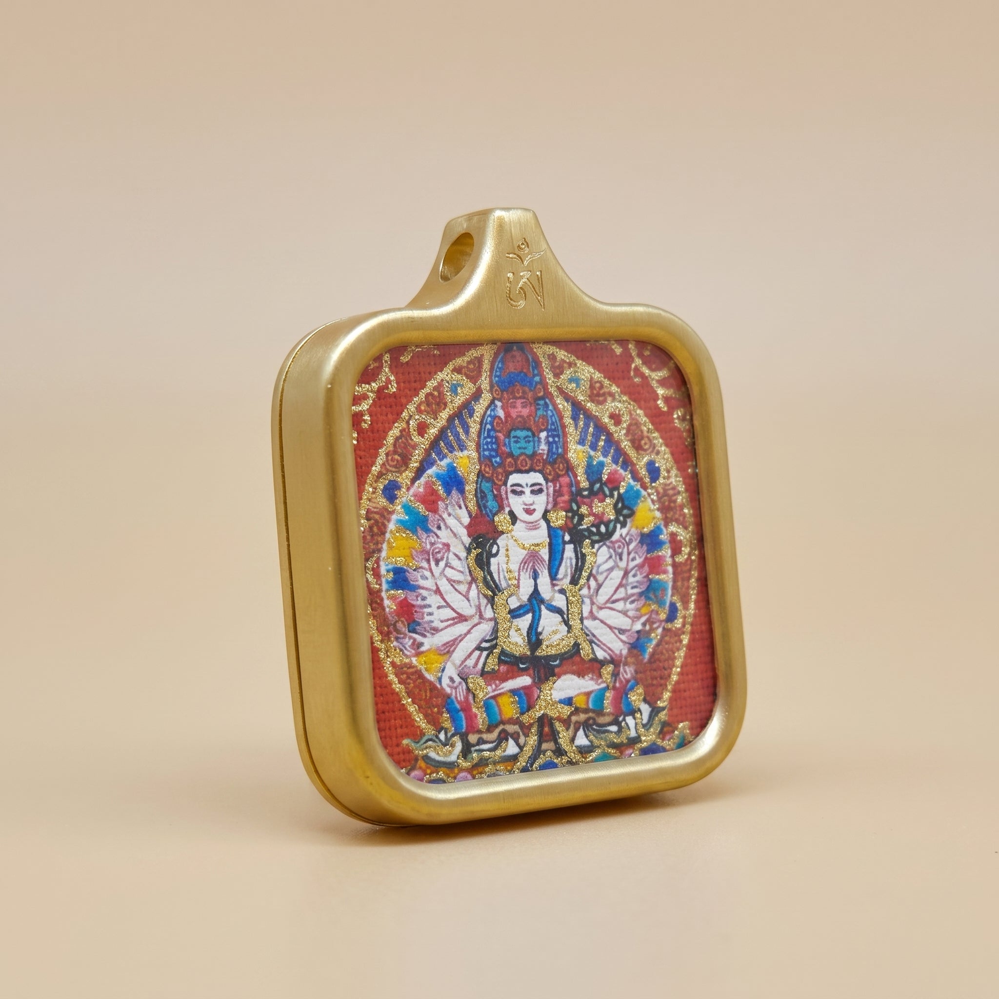 thousand-arm-guanyin-hand-painted-gold-line-amulet-angled-view.jpg